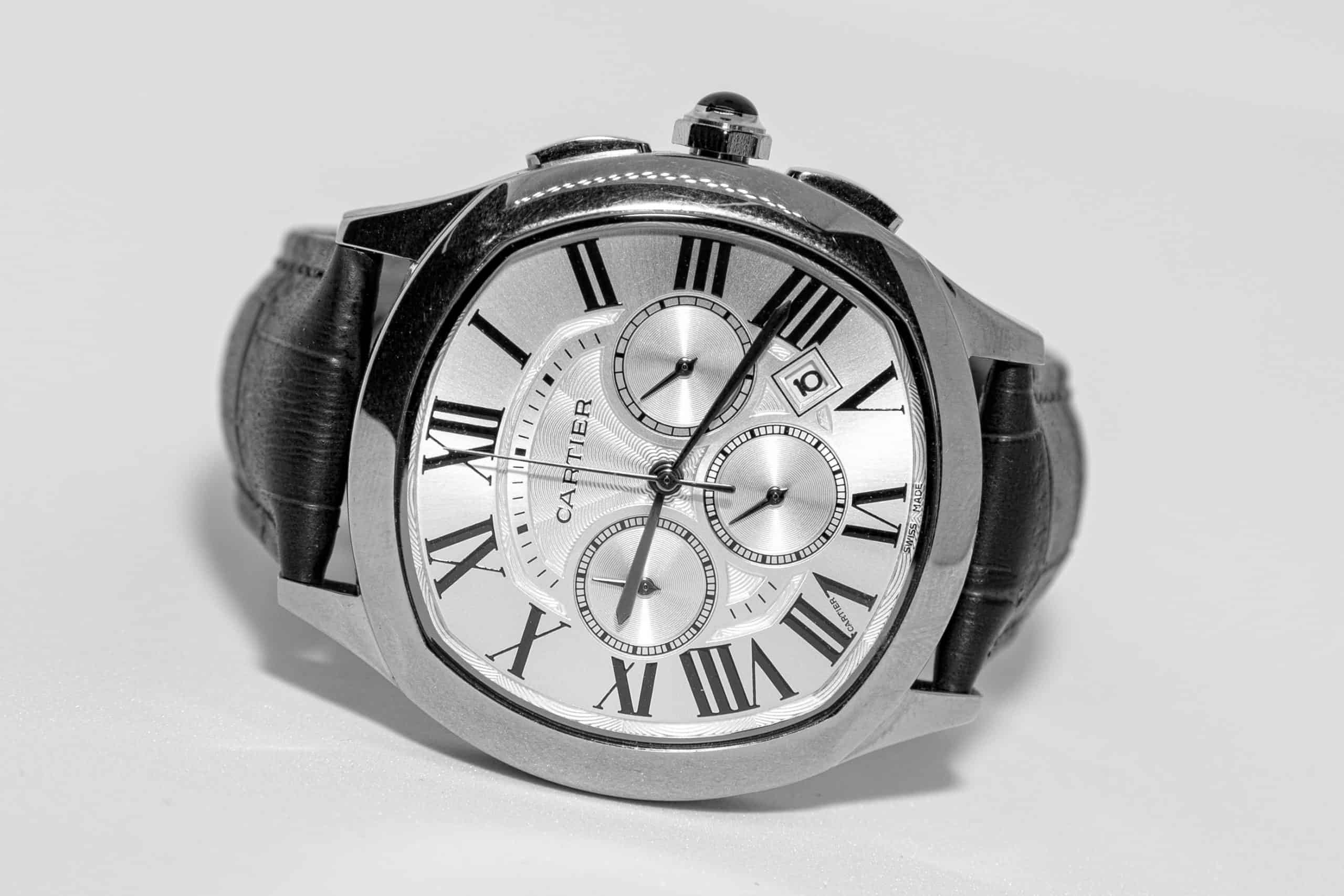 A black and white photo of a watch