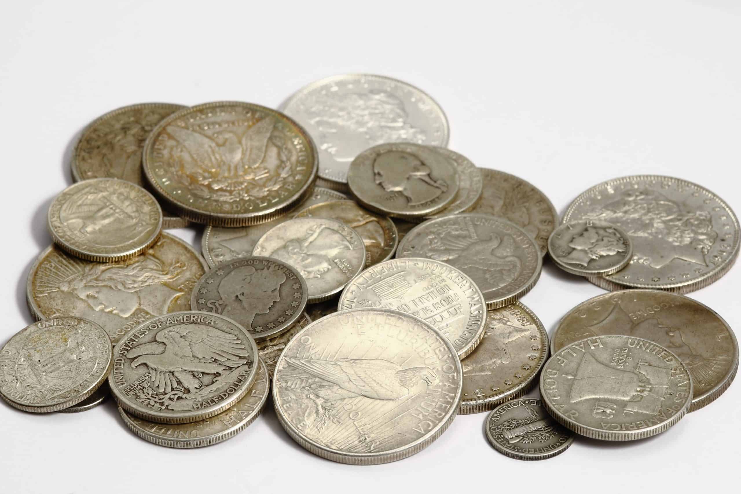 A pile of old coins is shown in this photo A pile of old coins is shown in this photo