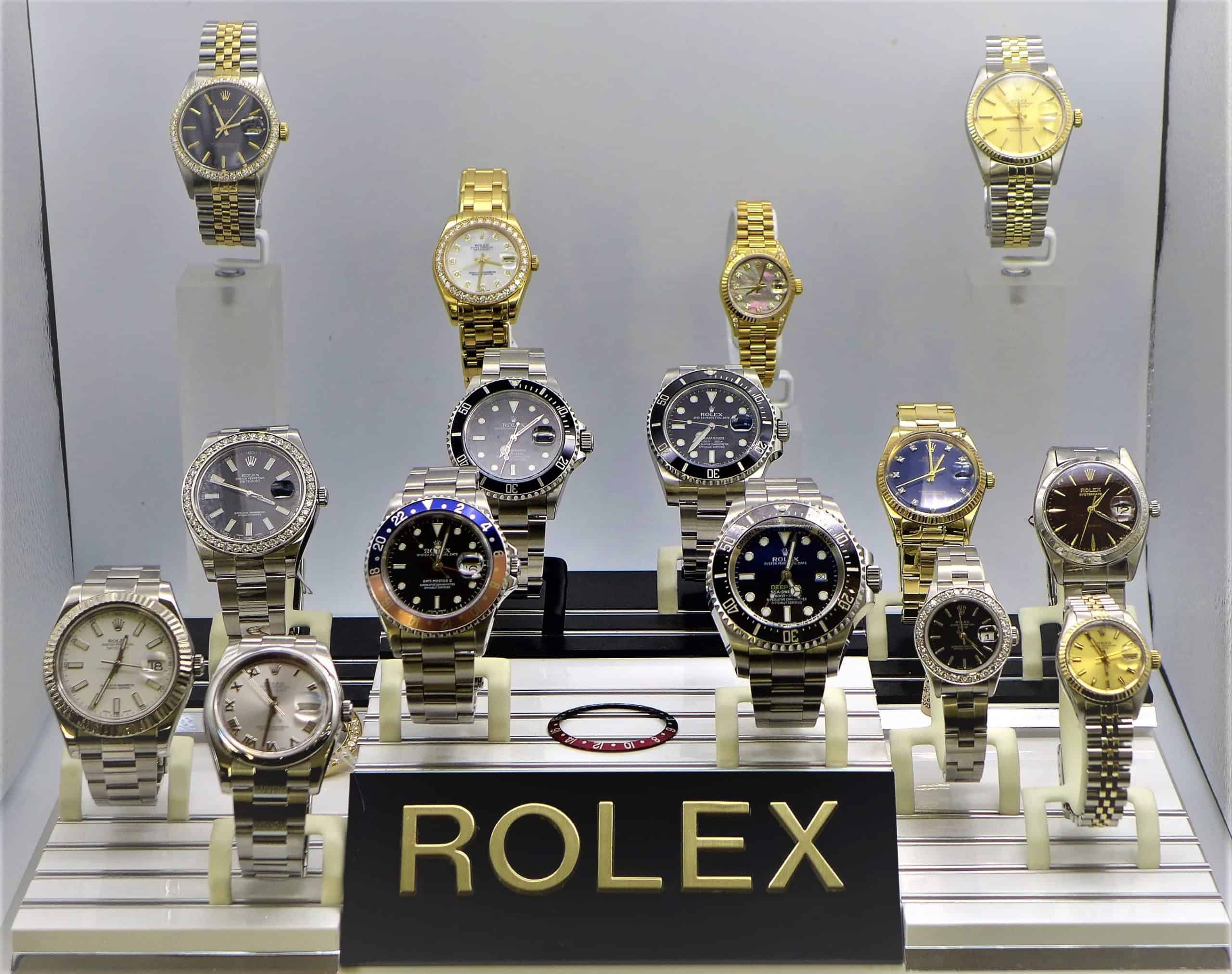 A display case with many different Rolex watches on display