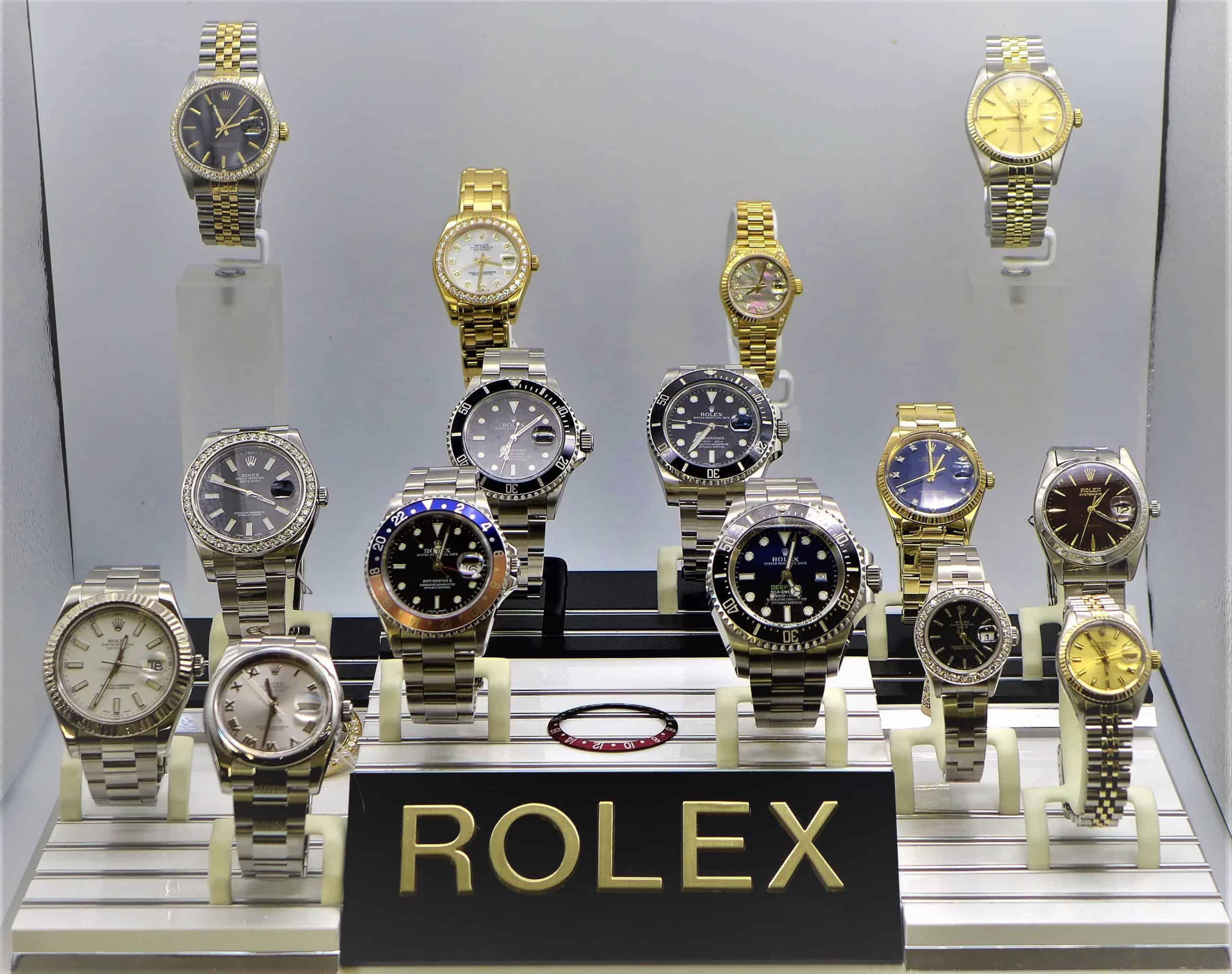 A display case with many different Rolex watches on display