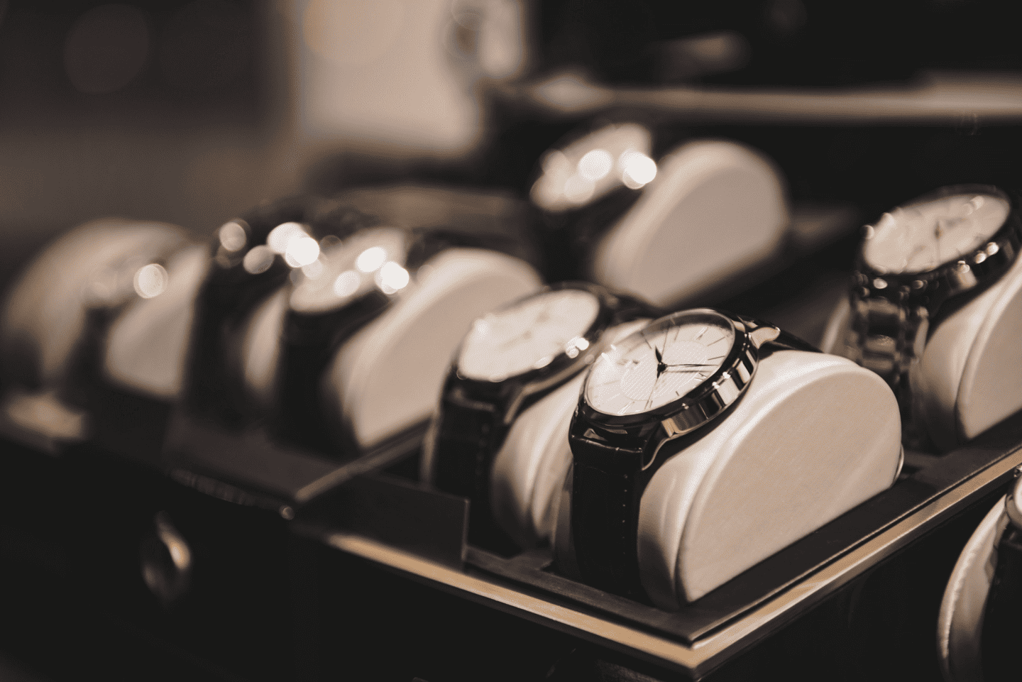 A row of watches on display in a store